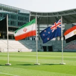 World Cup 2026 Group G featuring Belgium, Iran, New Zealand and Egypt national flags in stadium setting